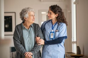 Nurse assisting older person